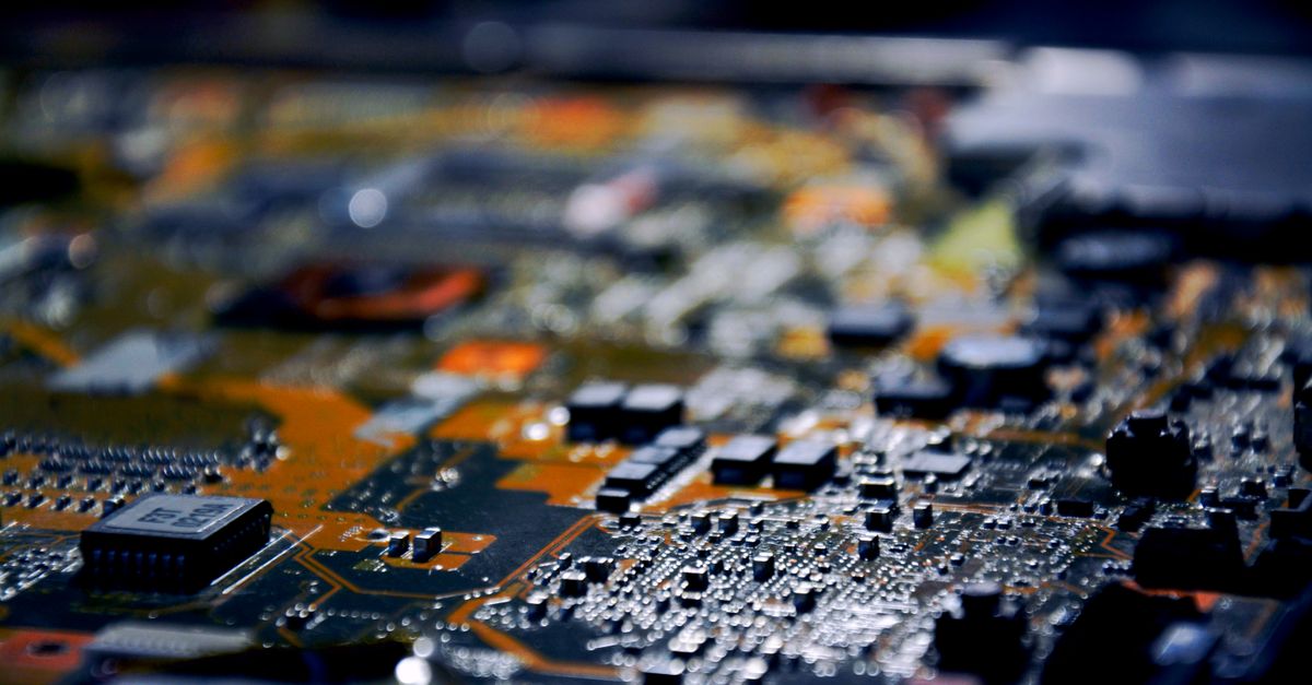 Detailed close-up view of electronic circuit board, showcasing modern technology.